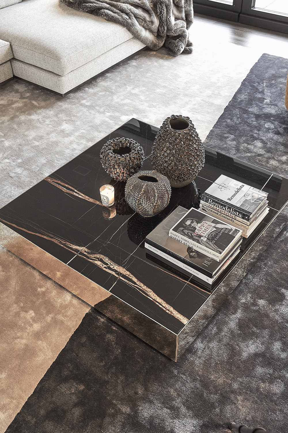Minotti coffee table and detail view of carpet